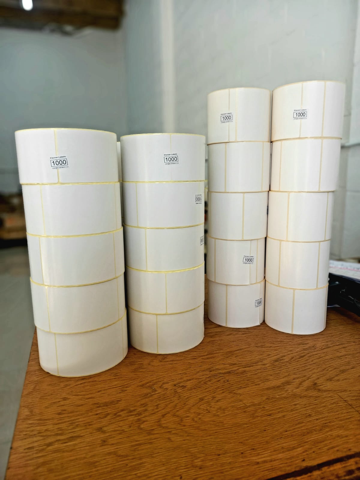 Stacked Elysian Labels direct thermal label rolls, detail view